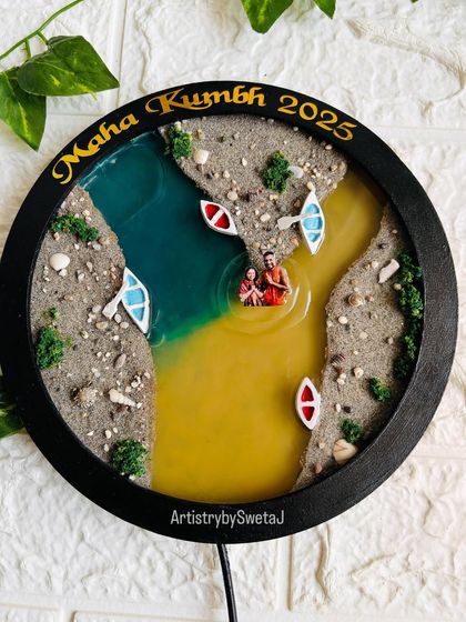 The final Maha Kumbh 2025 preservation piece, featuring a couple's photo in the sacred waters of the Triveni Sangam. It’s a memory of faith, turned into a timeless memento.