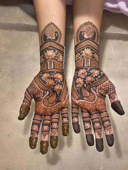 This design is a celebration of nature's beauty, with elegant peacocks and blooming lotuses. The use of negative space makes the motifs stand out beautifully.