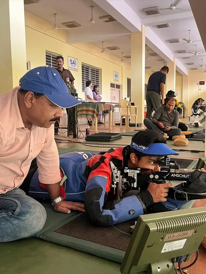 A close-up of a 50M Prone practice session, where I help a shooter fine-tune his position and aim for maximum stability and accuracy.