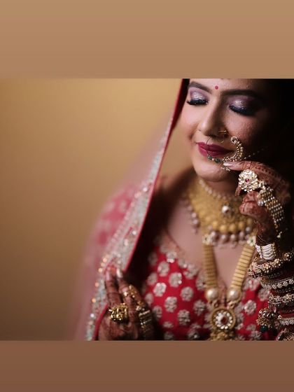 A beautiful, artistic shot of my bride. The focus is on her expression and the flawless makeup that enhances her features.