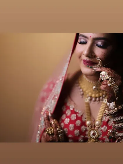 A beautiful, artistic shot of my bride. The focus is on her expression and the flawless makeup that enhances her features.