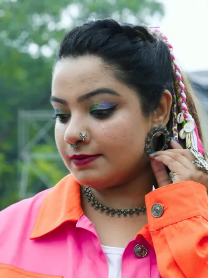 Another detailed shot of my look, showcasing the colorful eye makeup and bohemian hair accessories.