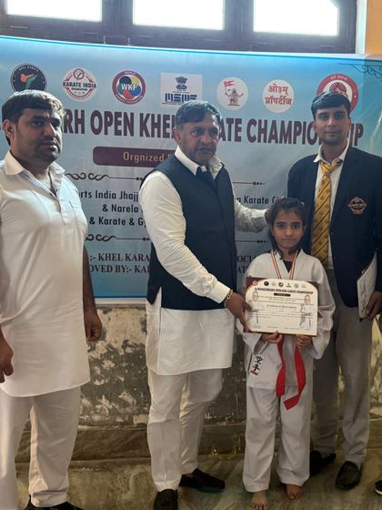 This young girl earned her certificate at the championship. I am dedicated to empowering the next generation of female fighters.