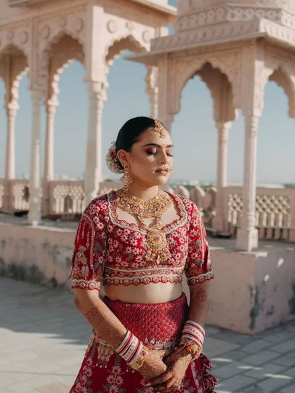 A serene portrait of the bride with her eyes closed, capturing a moment of calm and contemplation on her wedding day.