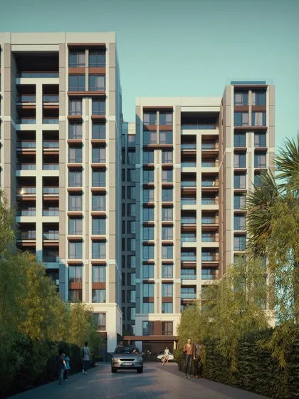 A street-level view of the premium mid-rise in Bandra, showing how the design creates a private and serene entrance. The architecture is crafted to elevate the living experience through thoughtful details and a connection to nature.