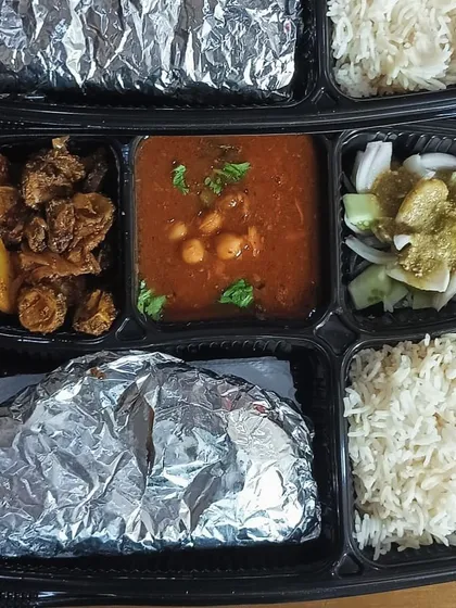 A comforting meal of chole masala and a dry vegetable sabzi. This is a typical North Indian lunch that is both filling and flavorful.