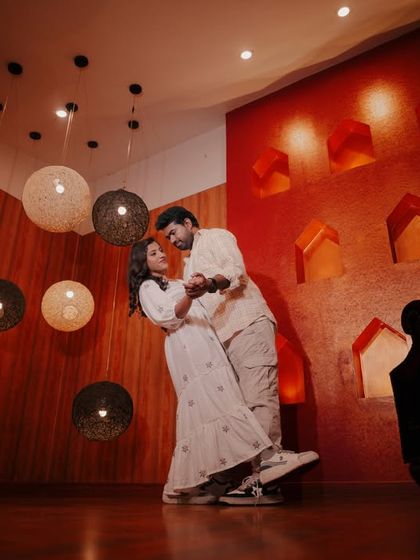 A creative shot in our royal room, using the unique hanging lamps to frame a dancing couple.