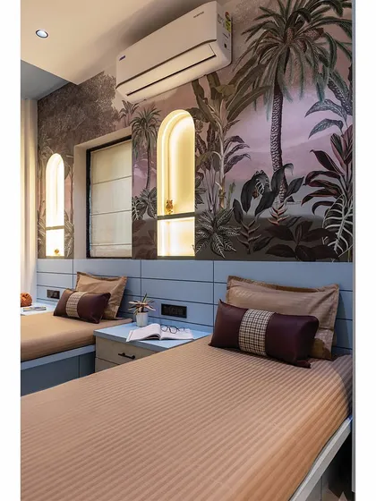 A close-up of the kids' room after transformation, showing the beautiful arched niches and botanical wallpaper.