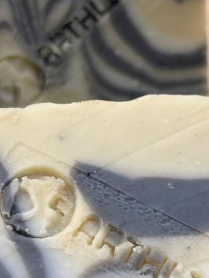 Another detailed look at our hand-stamped logo on the Charcoal & Dead Sea Mud Soap. This is a mark of our authentic, artisanal process.