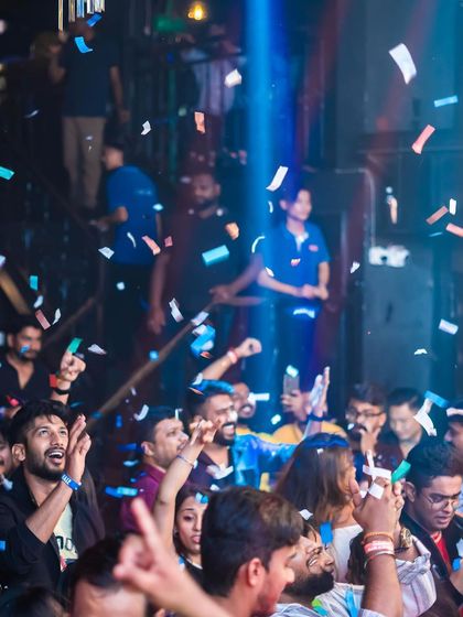 The crowd reacting to a confetti blast. The energy is always electric.