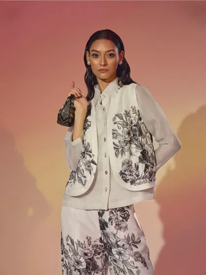A lighter, daytime festive look featuring a printed co-ord set with a matching vest. I styled this with a mini handbag for a chic, brunch-party-appropriate outfit.
