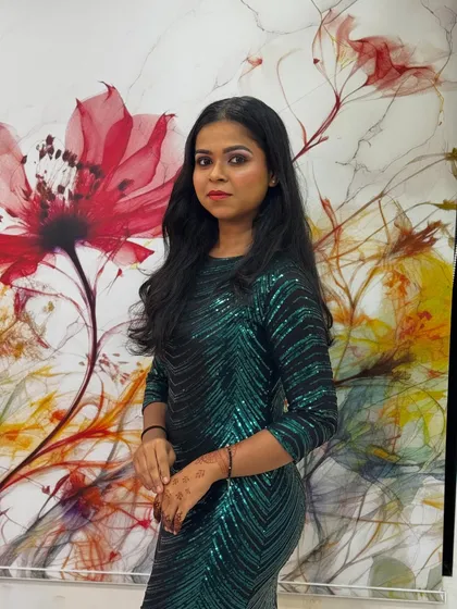 A confident pose showing off soft, wavy hair perfect for a party or special occasion. This simple yet elegant hairstyle is versatile and suits many different outfits.