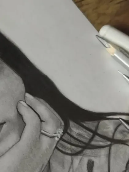 A macro shot showing the fine detail on the ring and the soft blending on the hand.