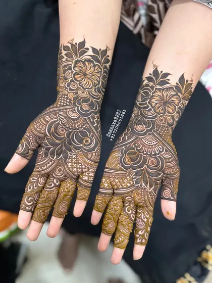 Here is another angle of the hibiscus palm design, showing how the pattern fills the hand completely. This style is great for photographs and looks stunning during festive ceremonies.