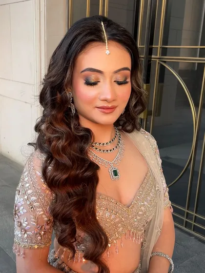 A close-up of the eye makeup paired with the soft waves. The entire look is a masterclass in soft, radiant glamour.