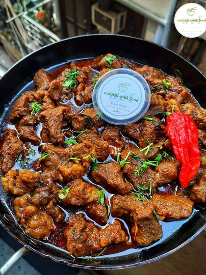 My hearty buff curry, garnished with fresh herbs and a whole king chilli for that extra kick.