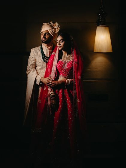 A dramatic, low-light portrait of the couple. We use creative lighting to create moody and cinematic images that feel like a movie still.