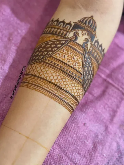 A different angle of the peacock arm band, showing the detail and symmetry.