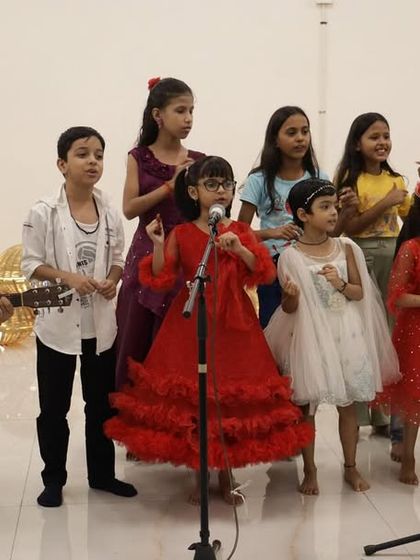 Our youngest group of singers from the Hobby Hub, dressed up and excited for their moment in the spotlight. Their joyful performance is always a highlight of the event.