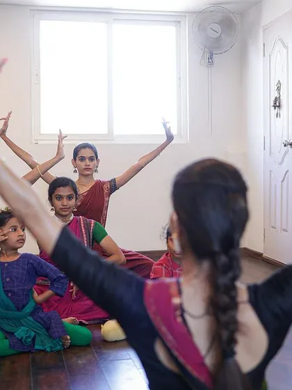 A view from my perspective as a teacher. Leading the class from the front, I demonstrate movements that my students mirror, building their muscle memory and technique together.