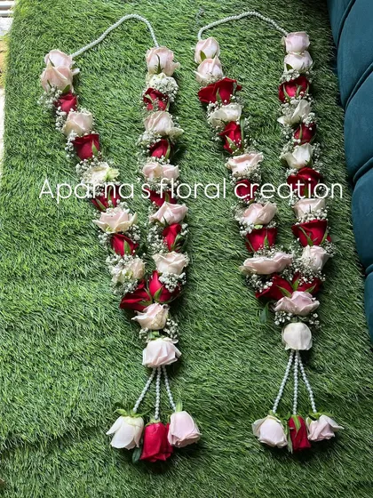 You can never go wrong with a classic. Here is a pair of fresh wedding varmalas I made, combining deep red and soft pink roses with tiny white flowers for a timeless and romantic look.