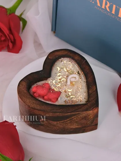 A wooden heart-shaped box candle, a rustic and romantic gift for your special someone.
