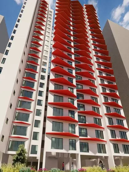 A different perspective of the experimental facade with red angled shades. This low-angle view emphasizes the three-dimensional quality of the modules and how they interact with light and shadow to create a dynamic surface.