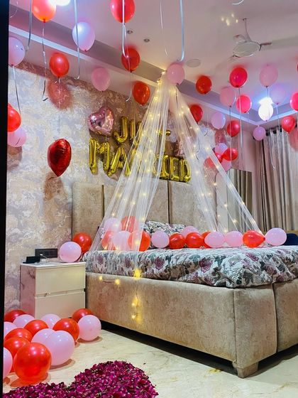 This angle highlights the "Just Married" foil balloons and the heart-shaped foil balloon, perfect for a newlywed couple.