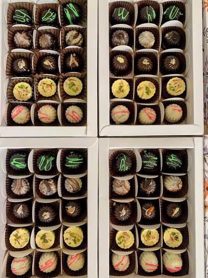 Multiple boxes of my assorted exotic chocolates, showing the variety and quantity I can prepare for corporate or festive gifting.