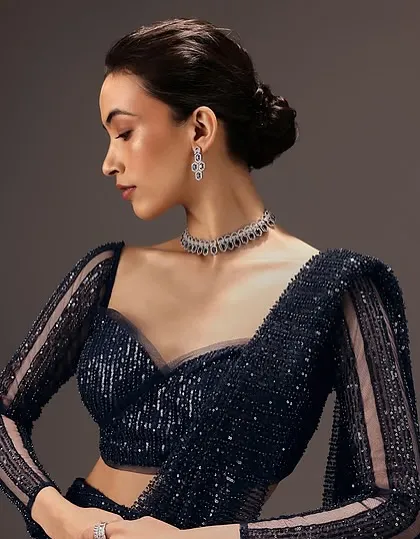This is a perfect example of the soft glam I create for commercial bridal and occasion wear. The look features a clean, elegant updo and defined yet natural makeup, ensuring the focus remains on the intricate designer blouse.