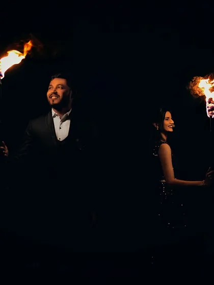Standing back-to-back, each holding a torch, this shot is about two individuals coming together to create a powerful flame. A very symbolic and dramatic pre-wedding concept.