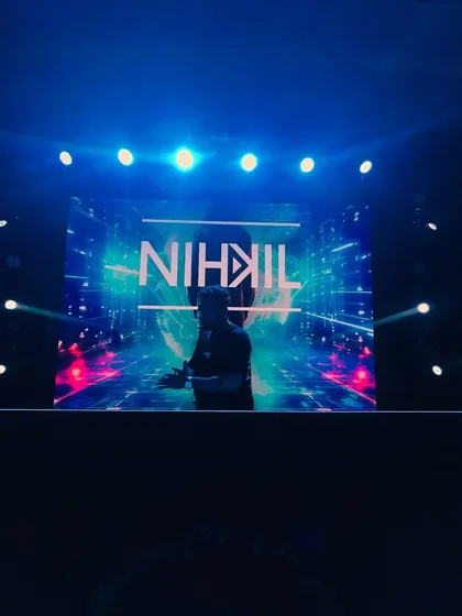 My custom visuals on the big screen behind me. I work to create a cohesive audio-visual show that represents my brand and energy.