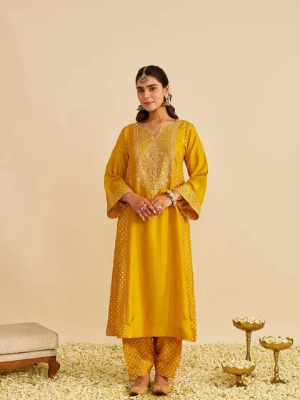 A frontal view of the mustard yellow kurta, featuring a beautifully embroidered yoke that adds a touch of festive sparkle.