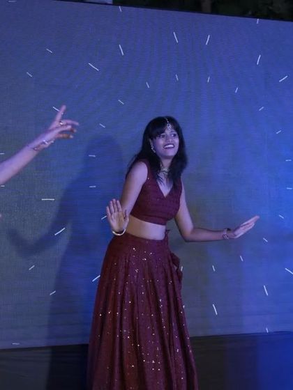 A candid shot of a dancer mid-performance, full of energy and joy. These are the moments that truly capture the spirit of the sangeet.