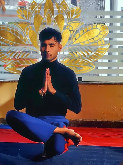 Finding balance and focus through a toe stand variation. This pose helps improve concentration and strengthens the ankles and core, representing the mental discipline and calm that is a key part of my wellness yoga sessions in Delhi.