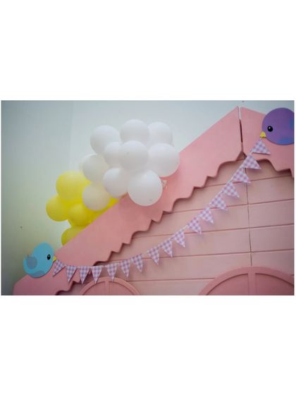 A duplicate image of the charming birdhouse roof detail.