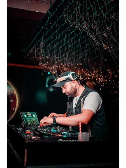 Focused on the details. A good DJ set is all about precision, and this photo shows me concentrating on the mix at my Pioneer console.