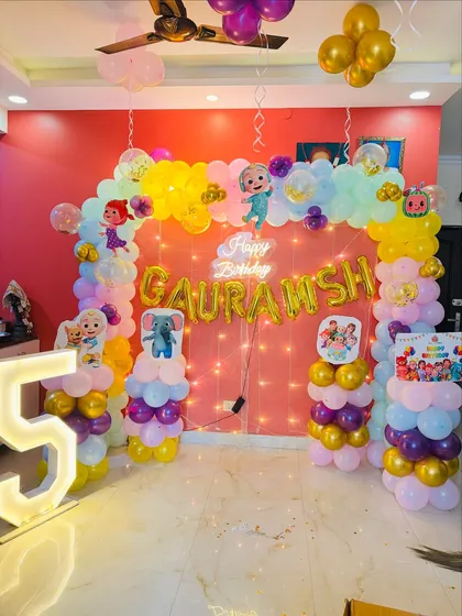 The full view of the colorful Cocomelon birthday party setup.