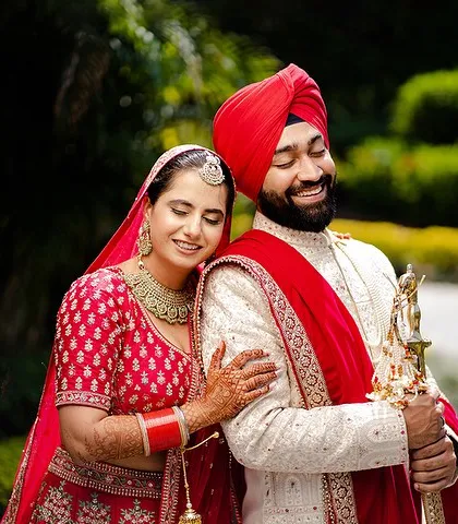 A candid, happy moment between the couple on their wedding day. The natural smiles and beautiful outdoor setting make this a cherished memory.