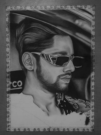 A step-by-step look at my 85-hour portrait of Baseer Ali. You can see the grid lines and how I build up the layers of graphite and charcoal to create a photorealistic effect.