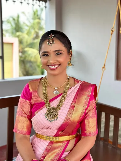 Sneha's beautiful smile says it all. For her engagement, I created a fresh and bright look with clean, defined eyes and a radiant smile to match her pink silk saree.