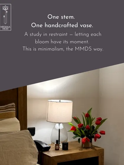 A study in restraint. This minimalist arrangement of red tulips in a simple vase shows that sometimes, less is more. This is minimalism, the MMDS way.