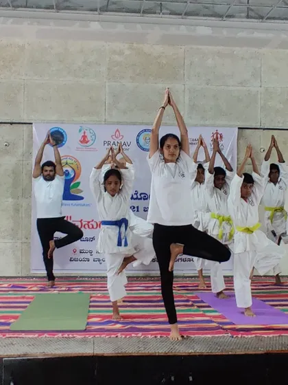 Fitness for me is about holistic development. We integrate yoga into our training, like this tree pose (Vrikshasana) session, to improve balance, concentration, and mental calm alongside physical strength.