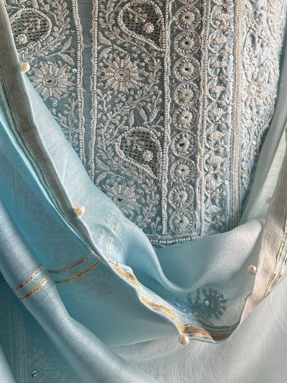 A detail shot of the dupatta border, embellished with gota and delicate seed pearls.