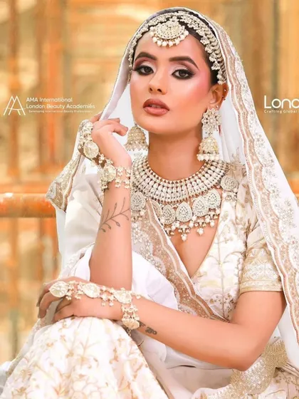 Create elegant and modern looks with our collection. This stunning ivory and white lehenga, paired with a matching Kundan jewellery set, is perfect for makeup artists wanting to showcase a sophisticated, contemporary bridal style in their portfolio.