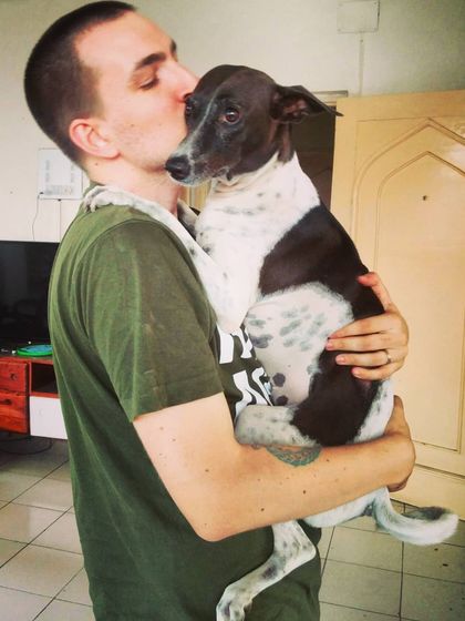 This is the lovely Luna getting a kiss from her dad. She's a fast runner who gives the best three-second hugs. I even customize her meals to make sure there are no peas, just the way she likes it.