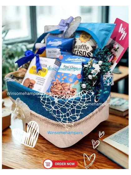 This munching hamper is styled beautifully on a desk, showing it's the perfect companion for a work-from-home treat or an office snack break.