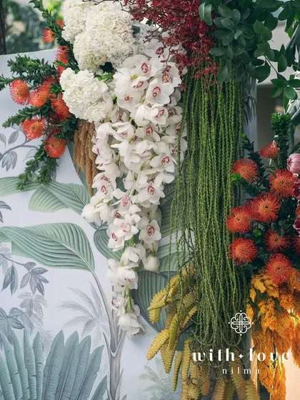 A close-up of the cascading white orchids from the 'Garden of Gaia' wall.