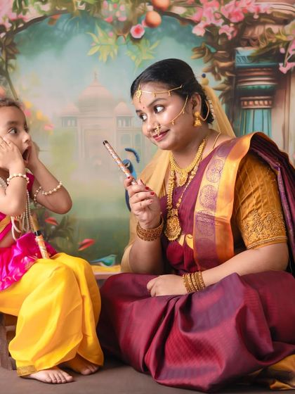 A playful interaction between mother and child. I encourage these moments to capture the fun and mischievous spirit of little Krishna.