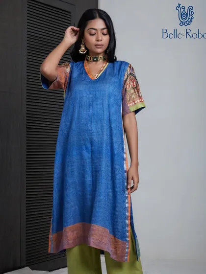 Another view of the blue kurta from Belle Robe. The makeup is consistently clean and minimal, reflecting the brand's focus on timeless, elegant clothing.